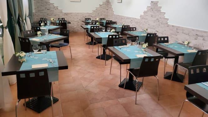 Ambiente interno del ristorante La Perla del Golfo